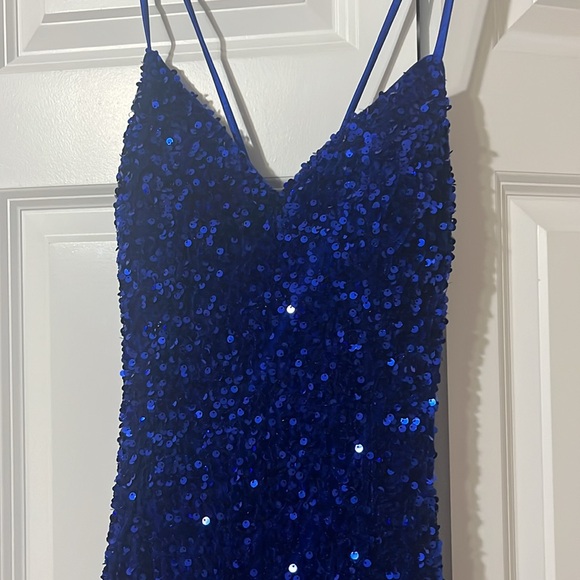 A navy blue prom dress. This is a size 2 from the store MDM. - Picture 3 of 4